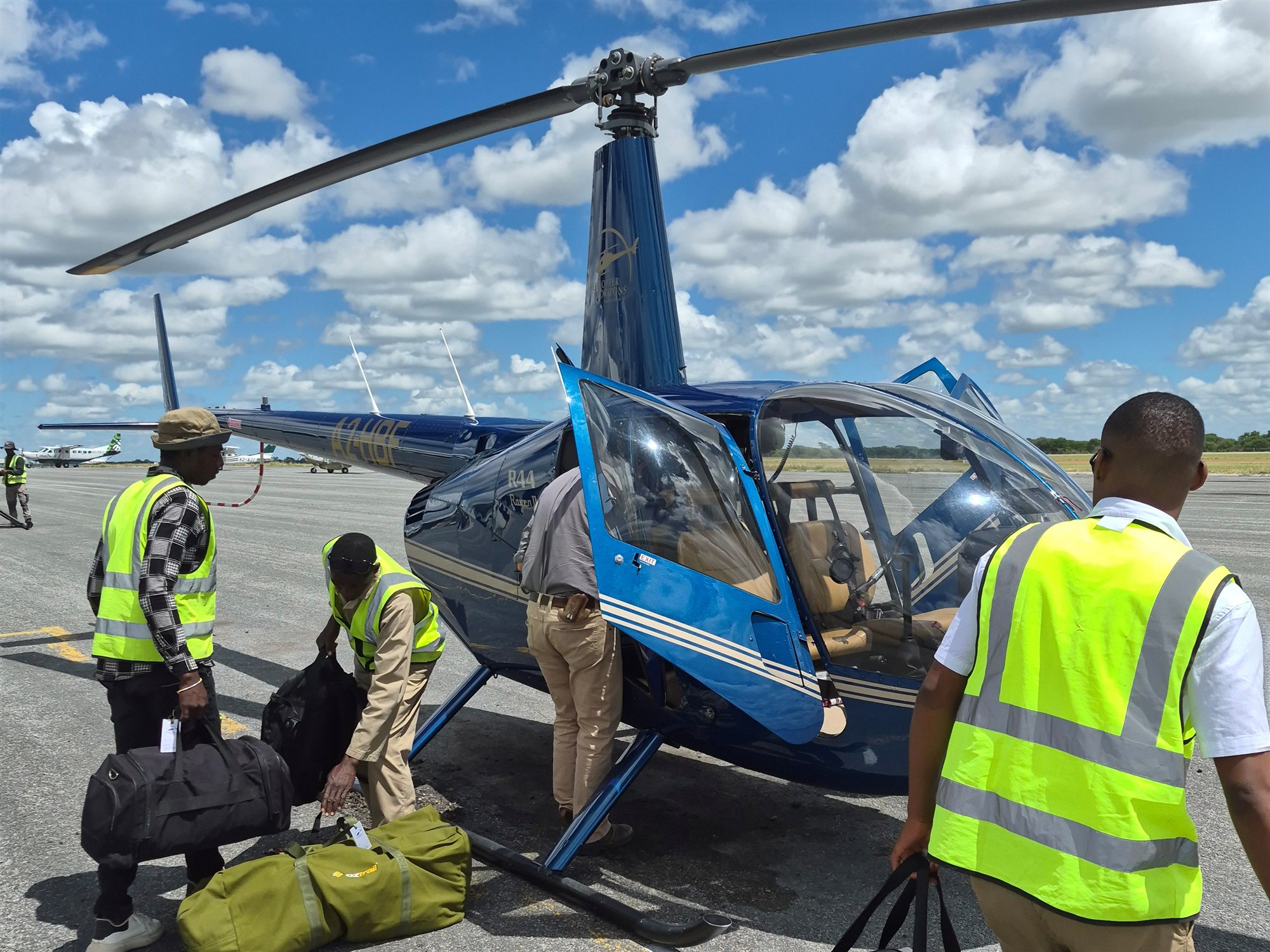 Luggage being loaded into a helicopter for an African transfer
